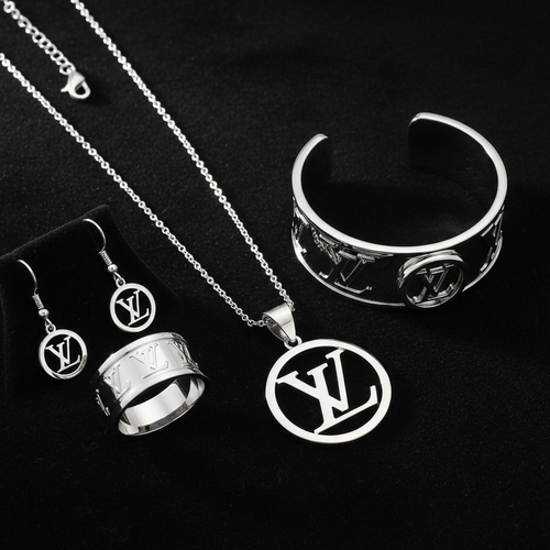 Luxury monogram white gold jewelry set on black velvet